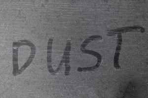 Dusty surface with written marking